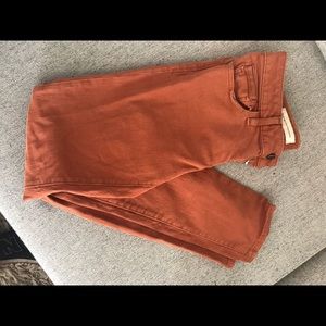 Rusty orange jeans.